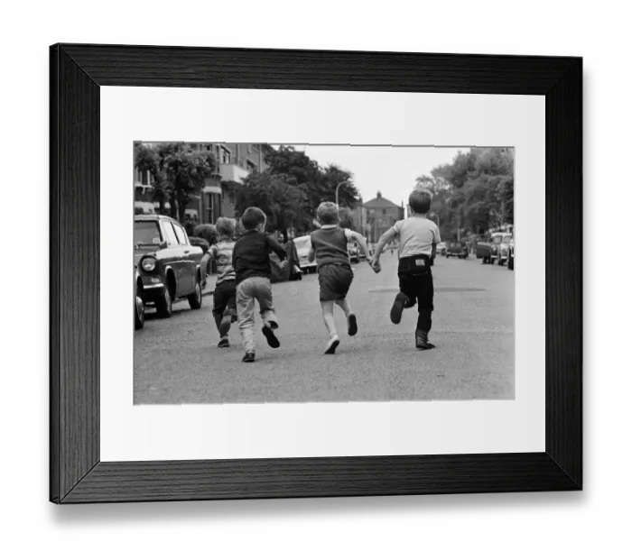 Framed Print : Children playing in the streets, running down the road. June 1964