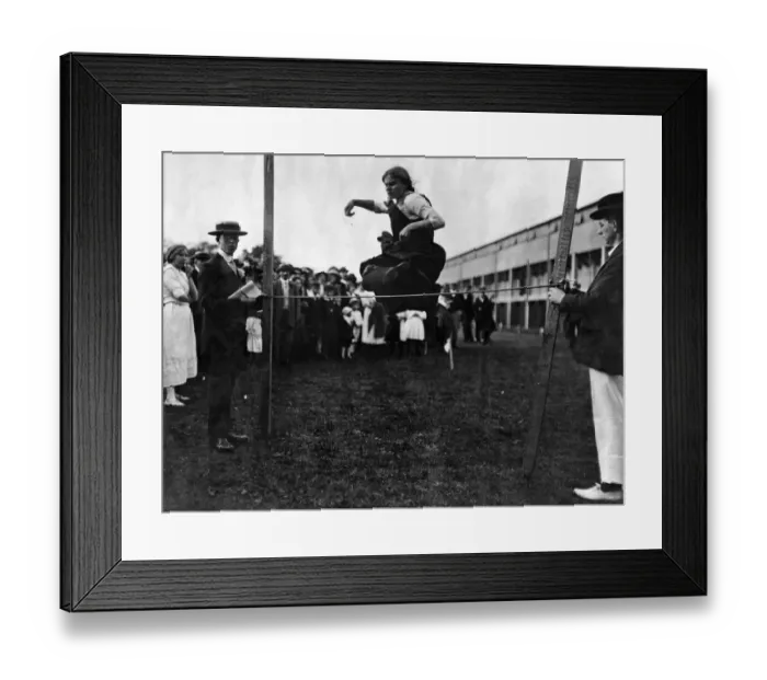 Framed Print : High jumping for girls at London sports event in connection with a garden-party