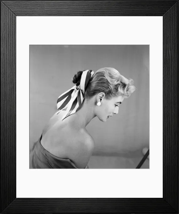 Framed Print : Cotton scarf and flower decorations for the hair, modelled by Pat O Reilly. July 1955 Framed Print : Cotton scarf and flower decorations for the hair, modelled by Pat O Reilly. July 1955