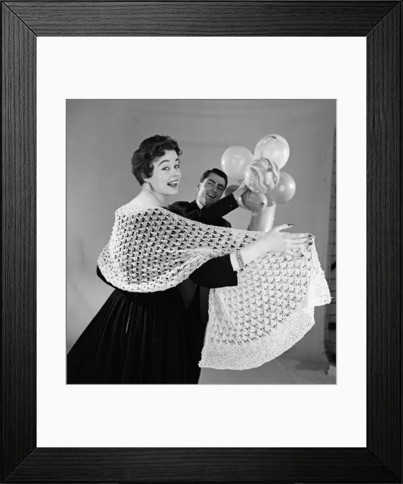 Framed Print : Knitted stole modelled by Jackie Jackson with Michael Bentley in background. July 1955