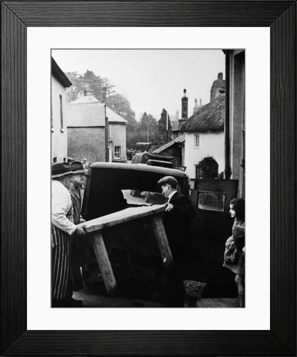 Framed Print : Slapton butcher moving the contents of his shop prior to completion of the evacuation of