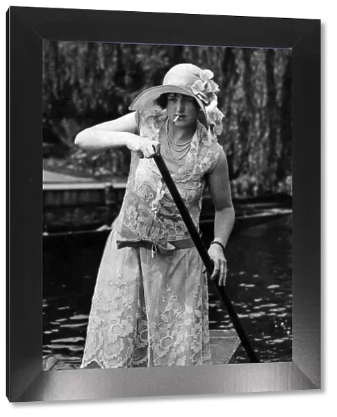 Fashions at Henley Regatta. Woman in a punt, smoking a cigarette. 1926