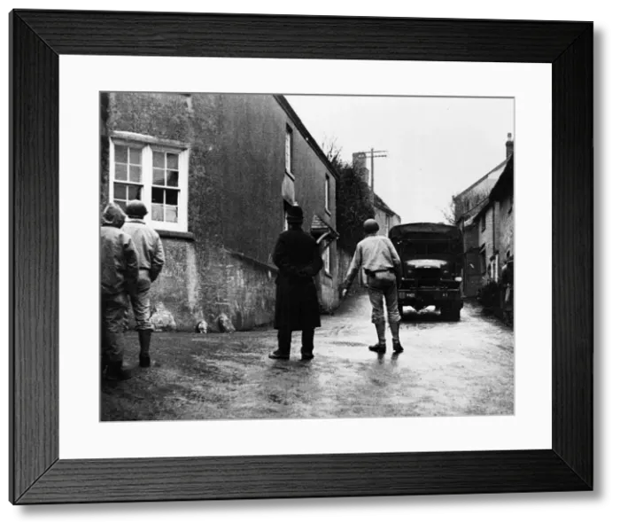 Framed Print : US troops arriving in Slapton to help the villagers move their possessions prior to Framed Print : US troops arriving in Slapton to help the villagers move their possessions prior to