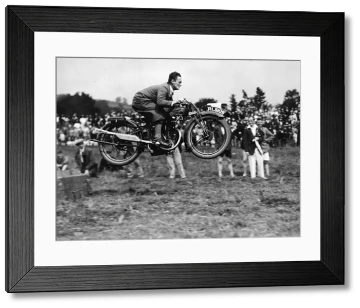 Framed Print : A competitor doing a long jump on his motor-cycle during the sports held in connection Framed Print : A competitor doing a long jump on his motor-cycle during the sports held in connection