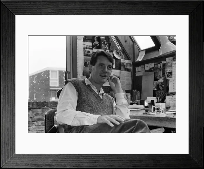 Framed Print : Actor and writer Michael Palin in his study at home. 7th November 1984