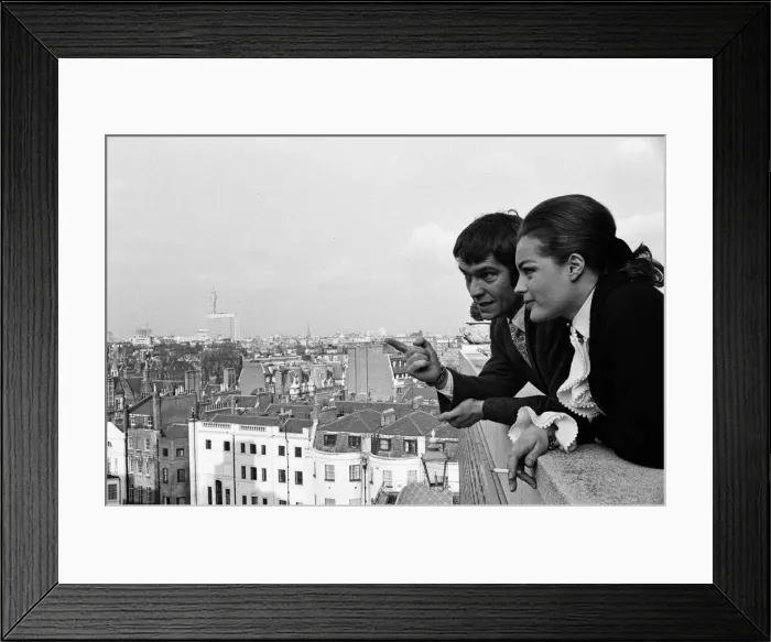 Framed Print : Tom Courtenay and Romy Schneider at the Dorchester Hotel looking at some of the places