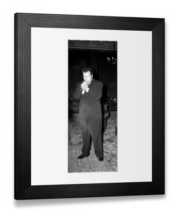 Framed Print : Orson Welles American Actor Film Producer - in London Hotel - smoking a cigar Framed Print : Orson Welles American Actor Film Producer - in London Hotel - smoking a cigar