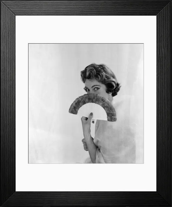 Framed Print : Woman pictured with a fan. Photographed for an article in The Daily Mirror by Helen Hugh Framed Print : Woman pictured with a fan. Photographed for an article in The Daily Mirror by Helen Hugh