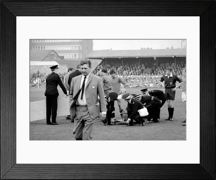 Framed Print : Alec Stock Manager of QPR - April 1968 walking away from injured player Morgan