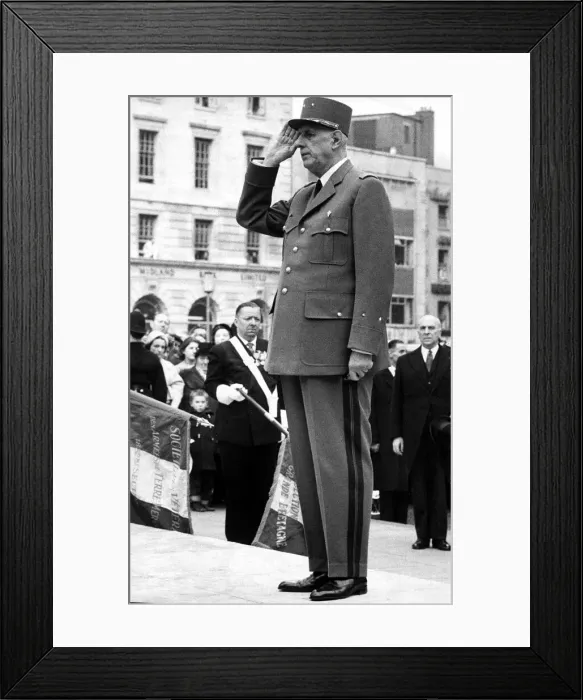 Framed Print : President Charles De Gaulle - salutes in front of the Marshall Foch statue in