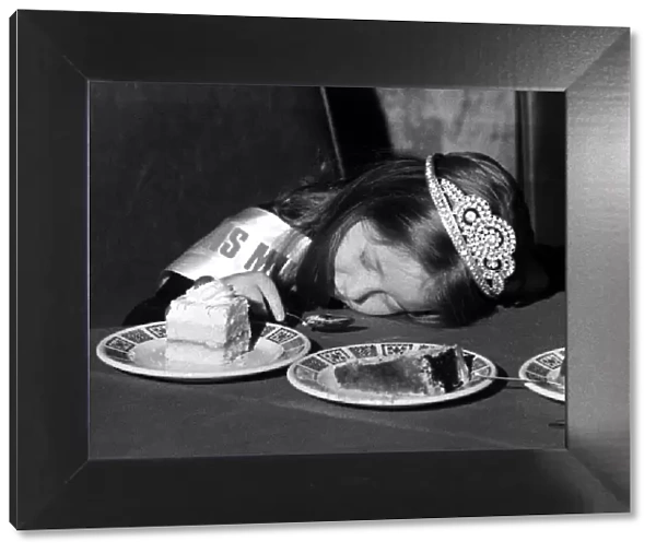 A young girl fall asleep on the table whilst eating a peice of cake - Childrens