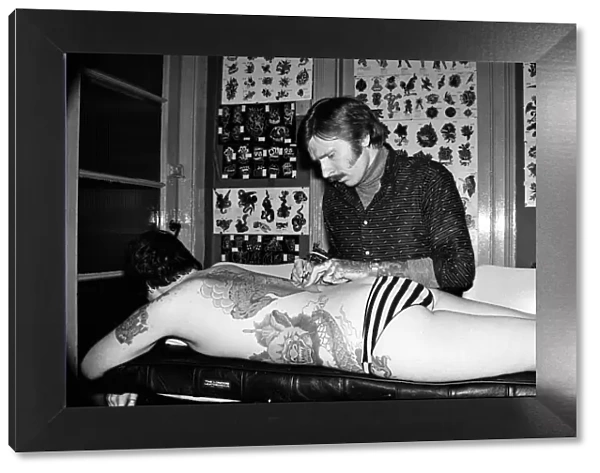 Tattooist George Bone at work. March 1977