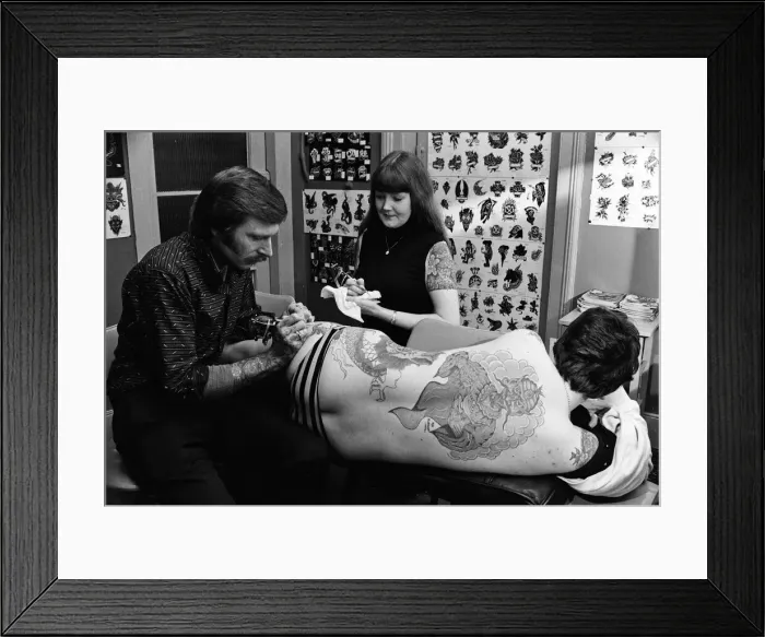 Framed Print : Tattooist George Bone at work. March 1977 Framed Print : Tattooist George Bone at work. March 1977