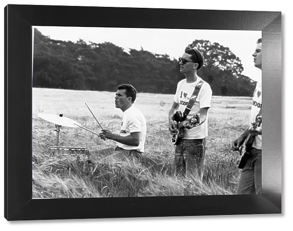 Dave Hemingway, Stan Cullimore and Norman Cook of the Housemartins filming a video at