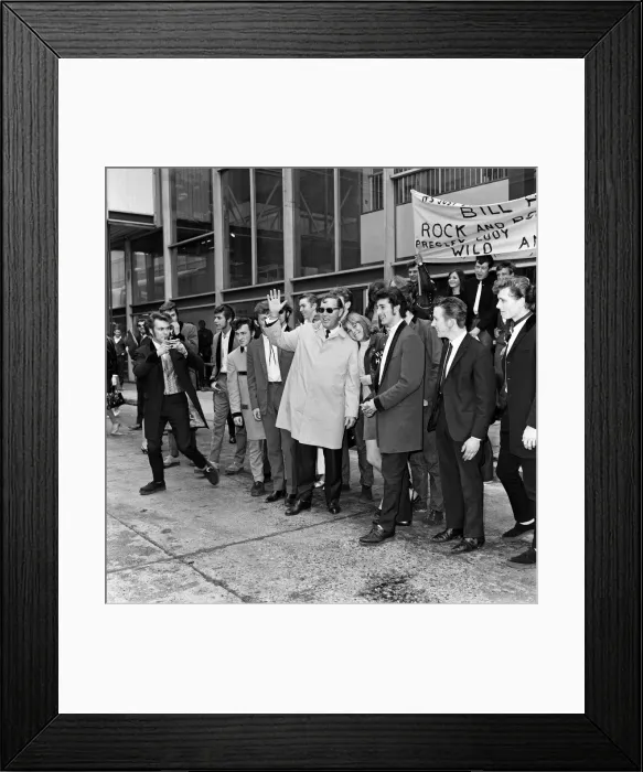 Framed Print : Bill Haley arrives at London Airport. Leather clad rockers from his fans club were