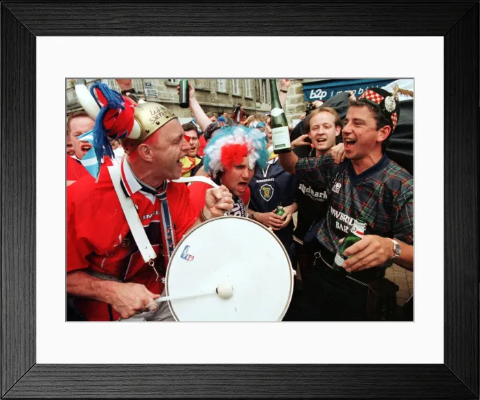 Framed Print : World Cup France 1998. Tartan army football fans make their way to the stadium in Framed Print : World Cup France 1998. Tartan army football fans make their way to the stadium in