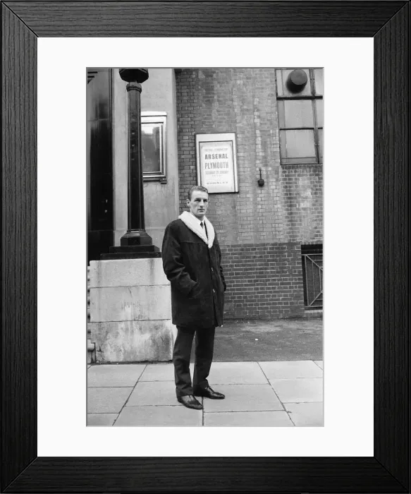 Framed Print : Arsenal inside forward George Eastham stands outside his club Framed Print : Arsenal inside forward George Eastham stands outside his club