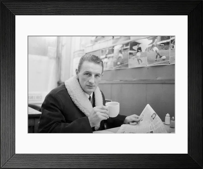 Framed Print : Arsenal inside forward George Eastham sits with a cup of tea in a cafe near his club Framed Print : Arsenal inside forward George Eastham sits with a cup of tea in a cafe near his club