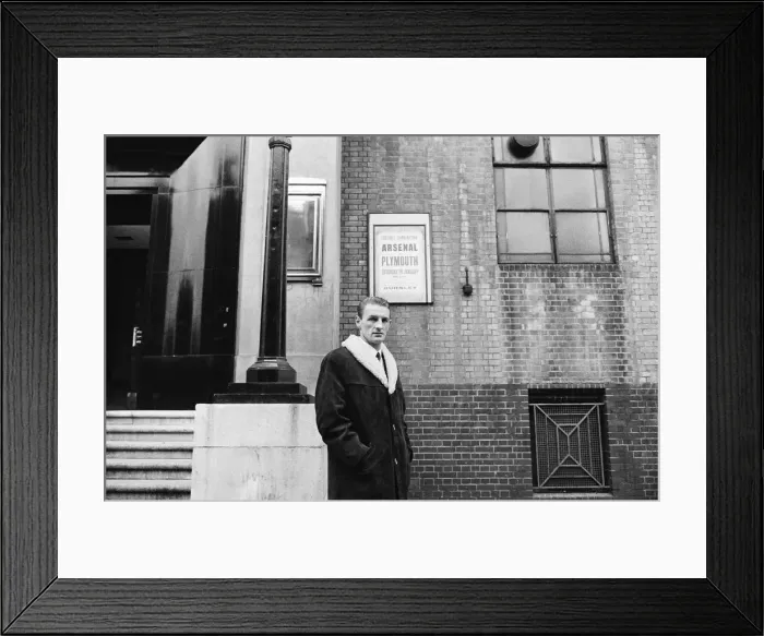 Framed Print : Arsenal inside forward George Eastham stands outside his club