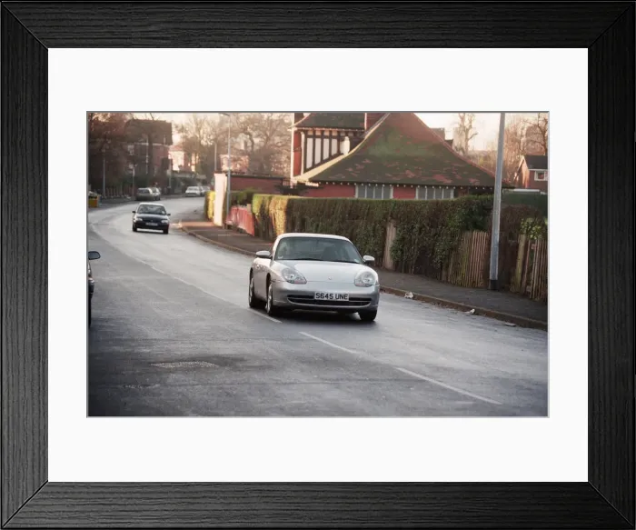 Framed Print : One of the Manchester United players driving their Porsche. 1st January 1999