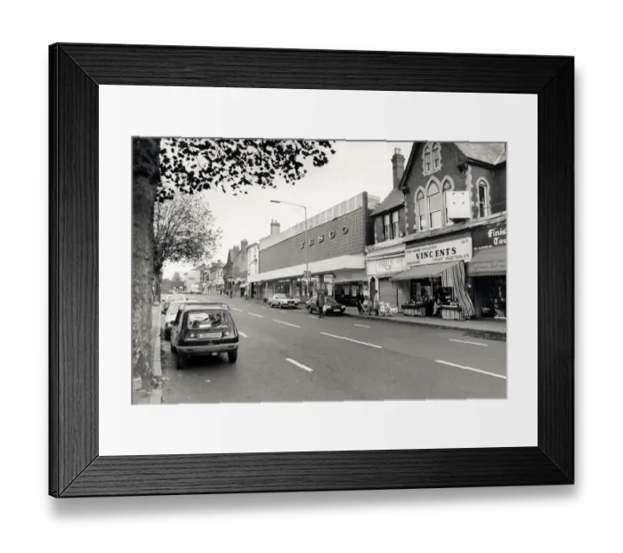 Framed Print : Moseley Village. Tescos 1960s style architecture in Moseley village swamps