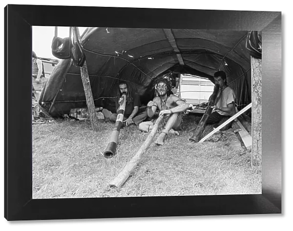 Glastonbury Festival 1994. Festival goers enjoy life with their didgeridoos
