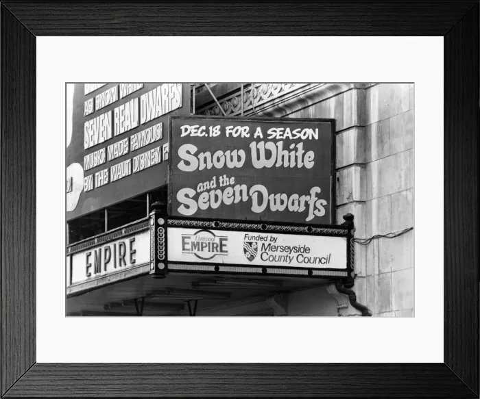 Framed Print : Exterior of the Empire Theatre, which is showing Snow White and the Seven Dwarfs Framed Print : Exterior of the Empire Theatre, which is showing Snow White and the Seven Dwarfs