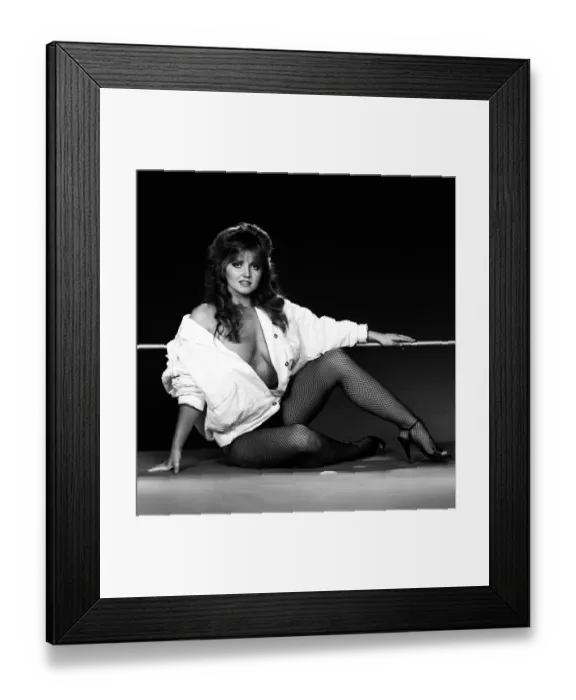 Framed Print : Linda Nolan models a mini dress and bomber jacket marketed under the Naughty Framed Print : Linda Nolan models a mini dress and bomber jacket marketed under the Naughty