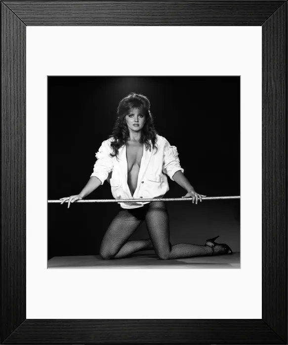 Framed Print : Linda Nolan models a mini dress and bomber jacket marketed under the Naughty