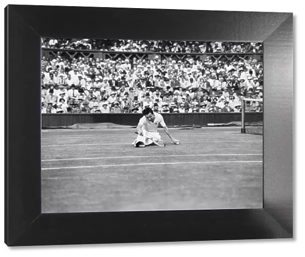 Fred Perry (GB) on the floor during his 1934 mens semi final match against Sidney Wood