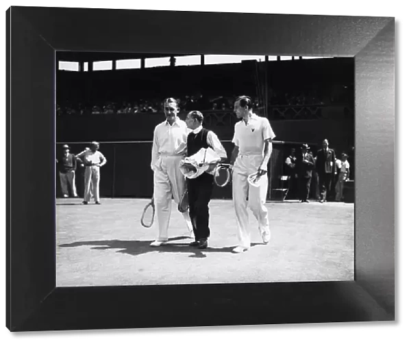 Fred Perry (right) walks out onto the centre court with his opponent Jack Crawford (left