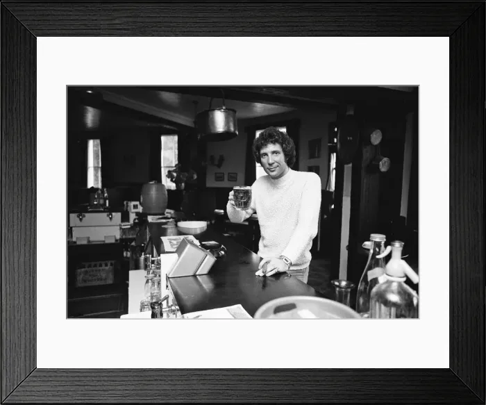 Framed Print : Singer Tom Jones has a quiet drink at his local in Weybridge after missing fans Framed Print : Singer Tom Jones has a quiet drink at his local in Weybridge after missing fans