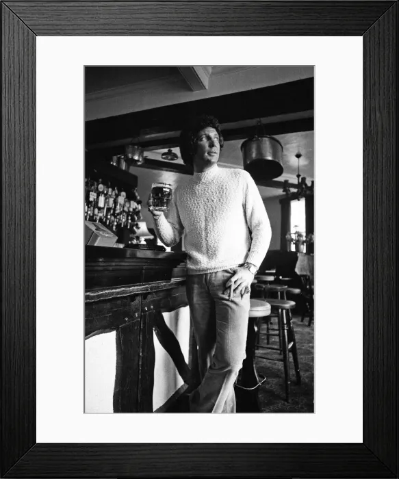 Framed Print : Singer Tom Jones has a quiet drink at his local in Weybridge after missing fans Framed Print : Singer Tom Jones has a quiet drink at his local in Weybridge after missing fans