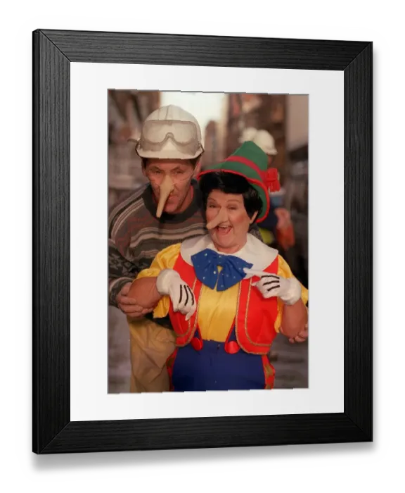 Framed Print : Janette Tough November 1998 as Jimmy Krankie wearing Pinocchio with construction builder