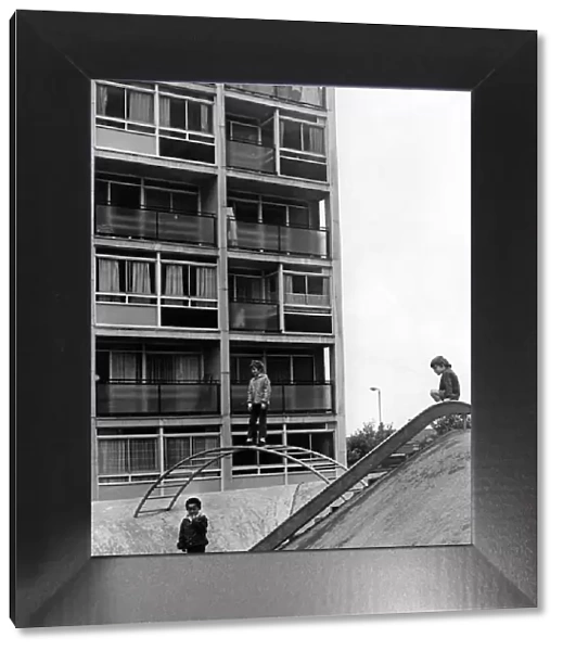 Children playing on play equipment on land between flats at Hillfields, Coventry