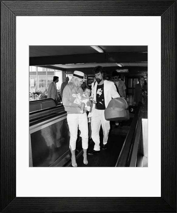 Framed Print : Billy Connolly and his wife Pamela Stephenson and their baby daughter Daisy arriving