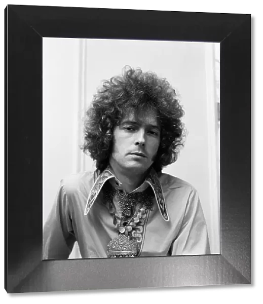 Eric Clapton of Cream shows off his curly hair that is created for him by a West End
