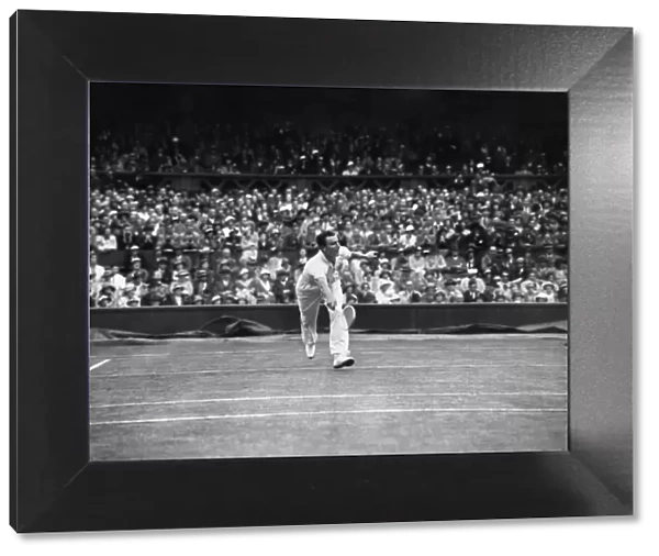 Fred Perry competing at The Mens singles Wimbledon Championships in 1934 on the centre