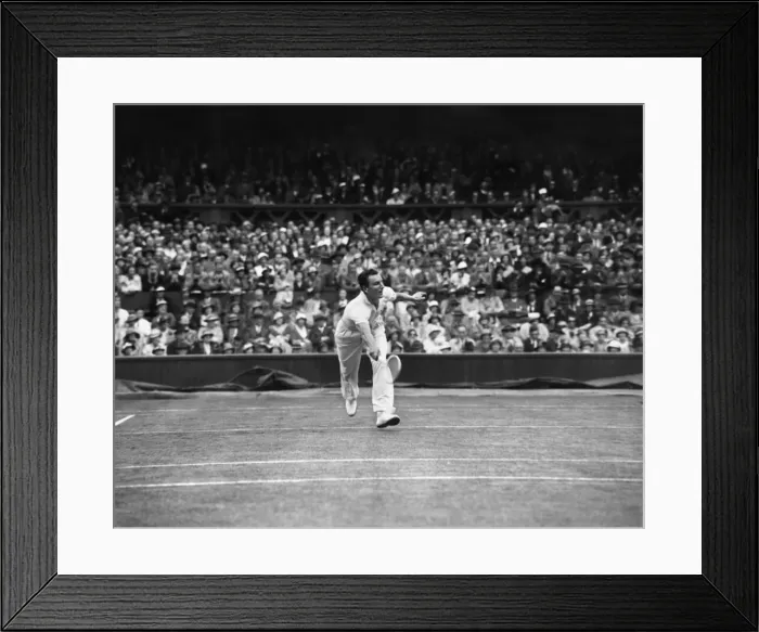 Framed Print : Fred Perry competing at The Mens singles Wimbledon Championships in 1934 on the centre Framed Print : Fred Perry competing at The Mens singles Wimbledon Championships in 1934 on the centre
