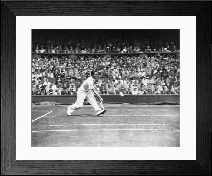 Framed Print : Fred Perry competing at The Mens singles Wimbledon Championships in 1934 on the centre
