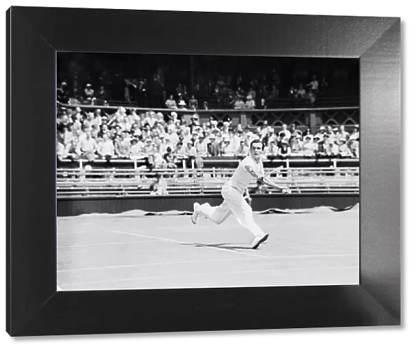 Fred Perry playing a backhand shot at The Wimbledon Mens Tennis Championships 1935