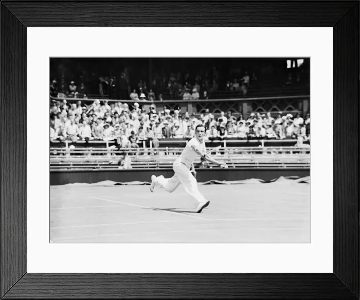 Framed Print : Fred Perry playing a backhand shot at The Wimbledon Mens Tennis Championships 1935
