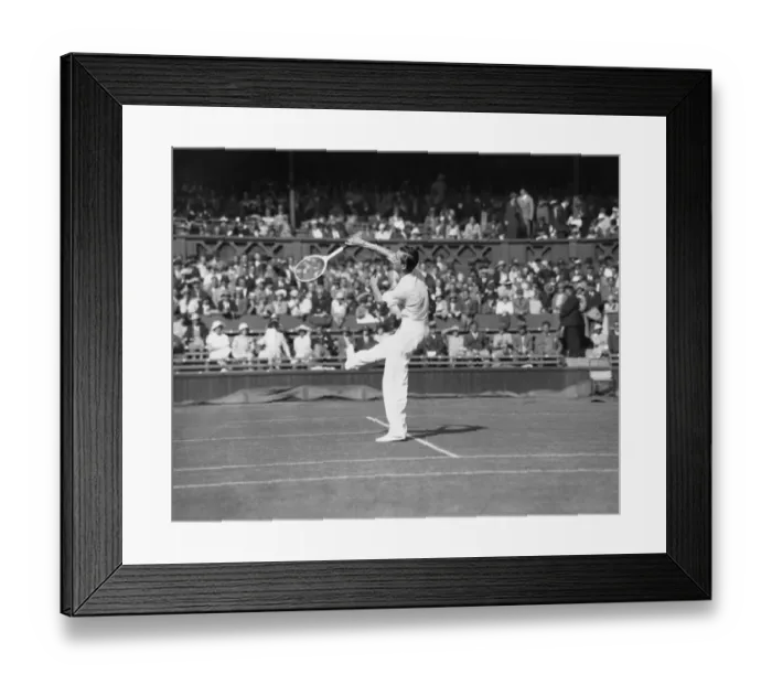 Framed Print : Fred Perry plays an overhead shot on The Centre Court at The Mens Wimbledon Tennis