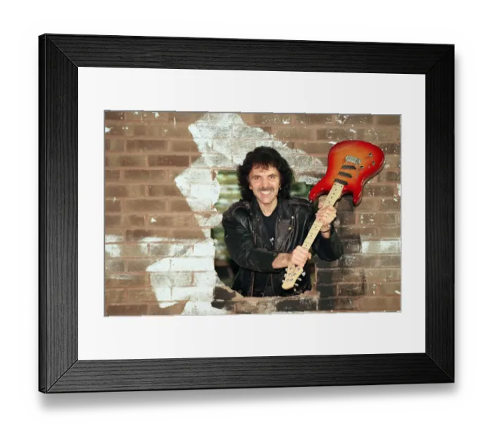 Framed Print : Black Sabbaths Tony Iommi helps to demolish a wall at Musical Exchanges in Framed Print : Black Sabbaths Tony Iommi helps to demolish a wall at Musical Exchanges in