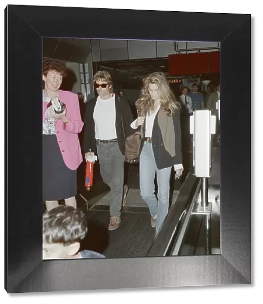 Cindy Crawford (model) at London Heathrow Airport. Cindy is with her husband, actor