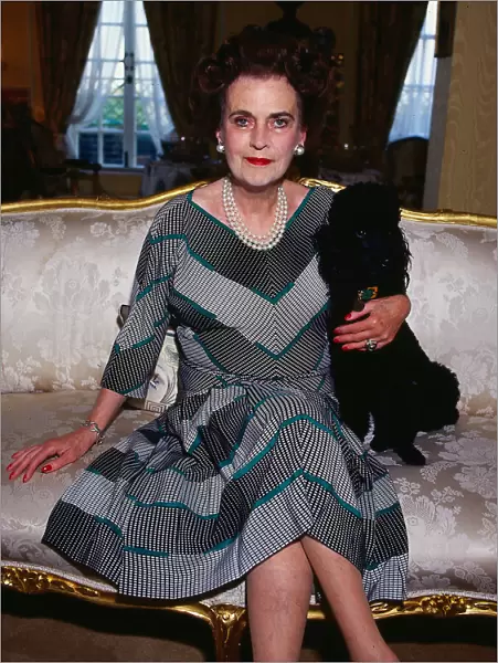 Margaret Duchess of Argyll February 1990. with her pet poodle on sofa sitting