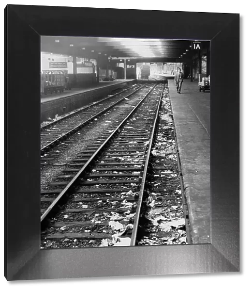 Litter on the tracks at New Street Station, Birmingham, West Midlands. 31st August 1955