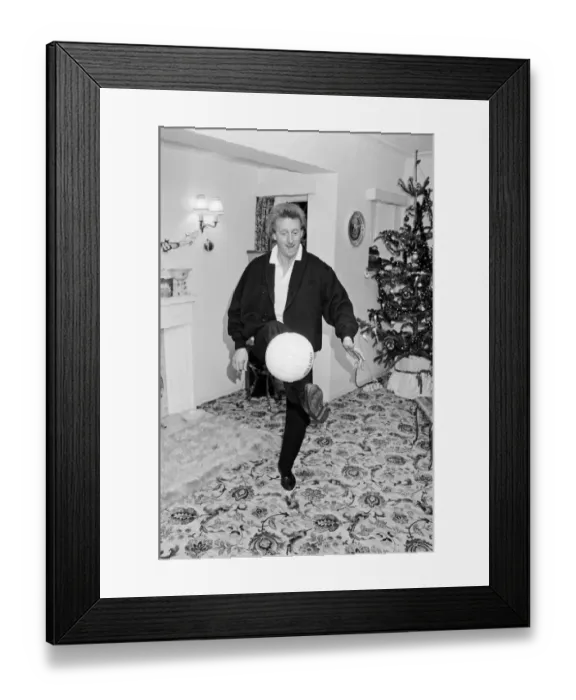 Framed Print : Denis Law, at home over Christmas in 1987. Denis Law CBE Framed Print : Denis Law, at home over Christmas in 1987. Denis Law CBE
