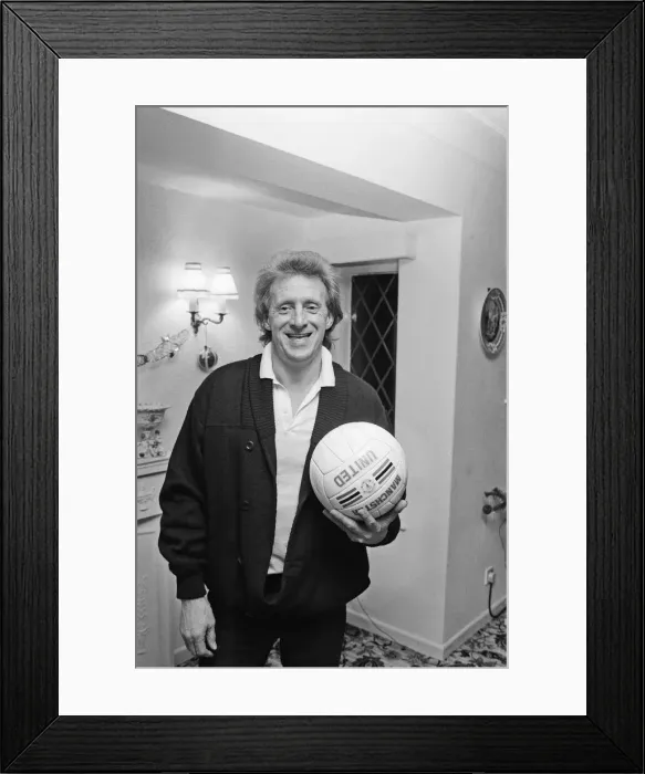 Framed Print : Denis Law, at home over Christmas in 1987. Denis Law CBE Framed Print : Denis Law, at home over Christmas in 1987. Denis Law CBE