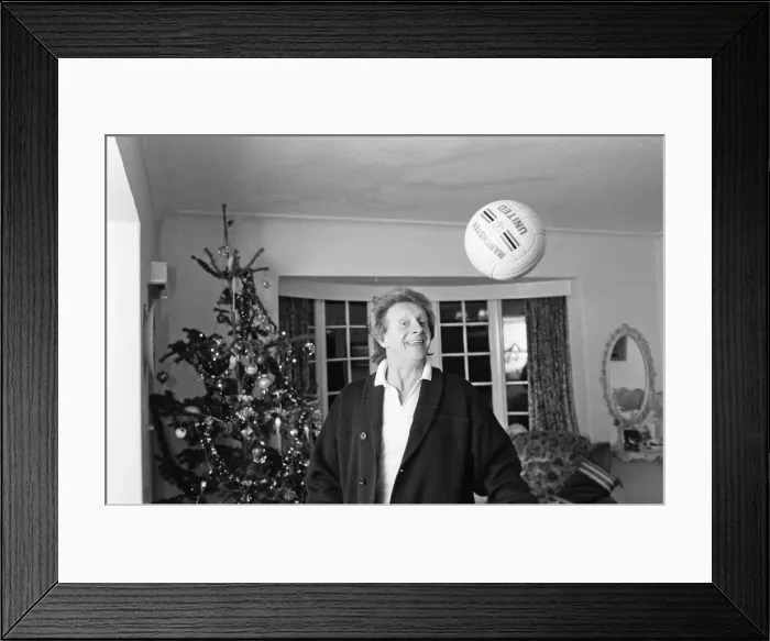 Framed Print : Denis Law, at home over Christmas in 1987. Denis Law CBE Framed Print : Denis Law, at home over Christmas in 1987. Denis Law CBE